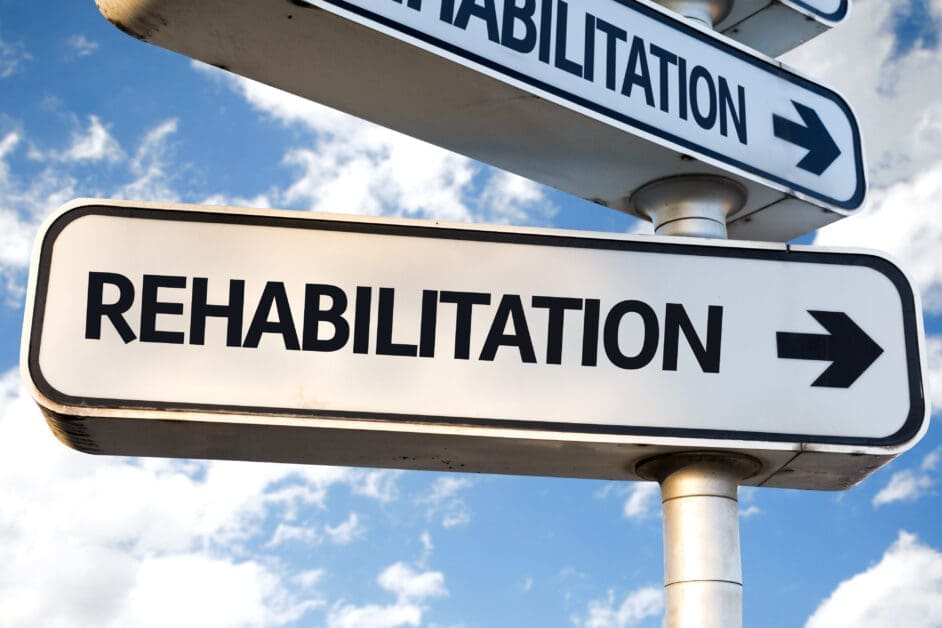 - Attorneys.Media - Legal Expert Interviews & Trusted Advice Directional Sign Reading Rehabilitation with a Right-pointing Arrow Against a Blue Sky.